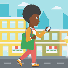 Image showing Woman walking with smartphone.