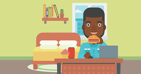 Image showing Man eating hamburger. 