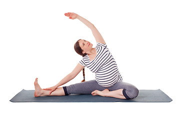 Image showing Pregnant woman doing yoga asana Parivrtta janu sirsasana