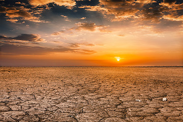 Image showing Cracked earth soil sunset landscape