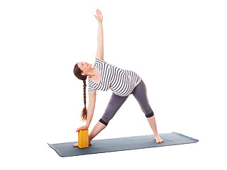 Image showing Pregnant woman doing yoga asana Utthita trikonasana