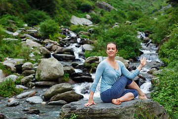 Image showing Woman doing Ardha matsyendrasana asana outdoors