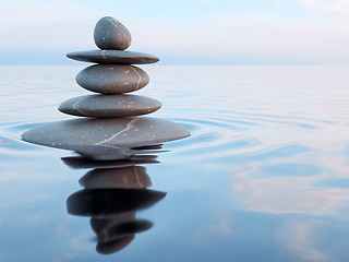 Image showing Balanced Zen stones in water 