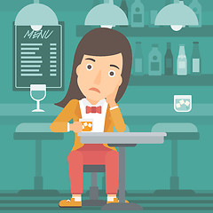 Image showing Woman sitting at bar.