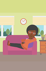 Image showing Woman lying on sofa.