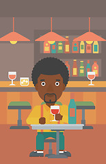 Image showing Man sitting at bar.