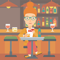 Image showing Woman sitting at bar.