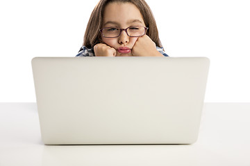 Image showing Little girl working with a laptop