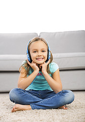 Image showing Cute girl listen music