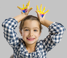 Image showing Little girl with hands in paint