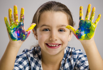 Image showing Little girl with hands in paint