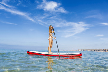 Image showing Woman practicing paddle