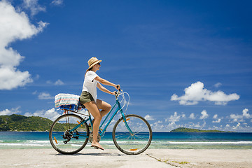 Image showing Woman ride along The Beach