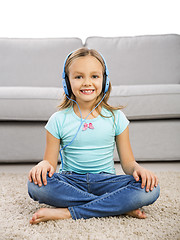 Image showing Cute girl listen music