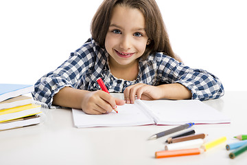 Image showing Little girl making drawings