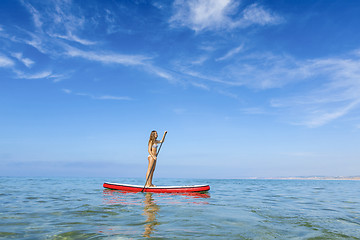 Image showing Woman practicing paddle