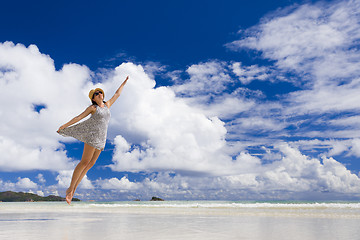 Image showing Beautiful woman jumping at the beach