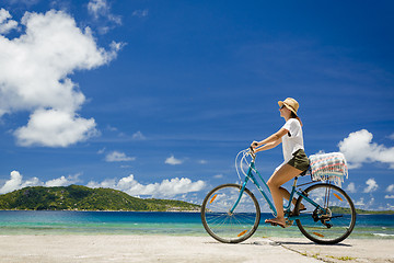 Image showing Woman ride along The Beach