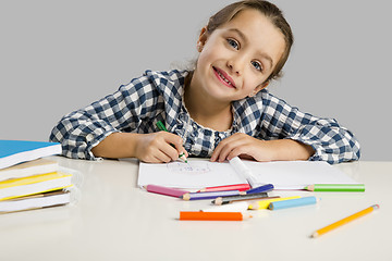 Image showing Little girl making drawings