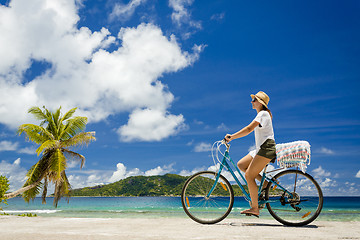 Image showing Woman ride along The Beach