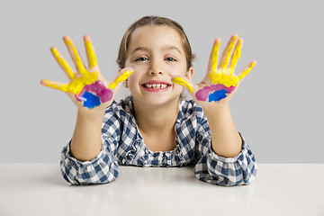 Image showing Little girl with hands in paint