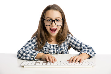Image showing Little girl working with a computer