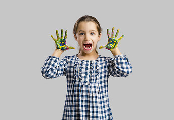 Image showing Little girl with hands in paint