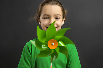 Image showing Little girl holding a windmill