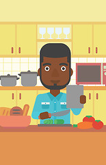 Image showing Man cooking meal.