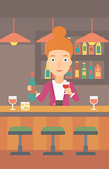 Image showing Bartender standing at the bar counter.