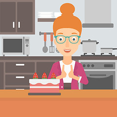 Image showing Woman looking at cake.