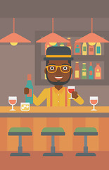 Image showing Bartender standing at the bar counter.