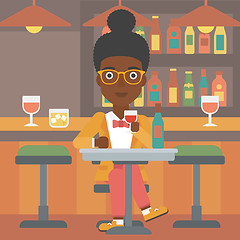 Image showing Woman sitting at bar.