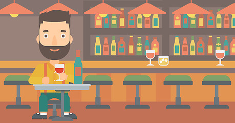 Image showing Man sitting at bar.