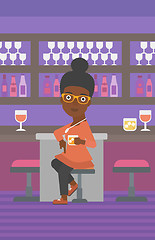 Image showing Woman sitting at bar.