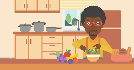 Image showing Man cooking vegetable salad.