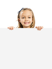 Image showing Cute Girl holding a whiteboard