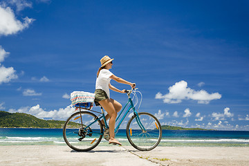 Image showing Woman ride along The Beach