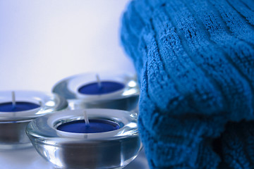 Image showing blue towel and three candles