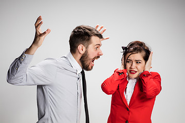 Image showing The business man and woman communicating on a gray background