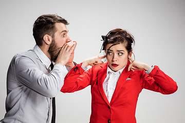 Image showing The business man and woman communicating on a gray background