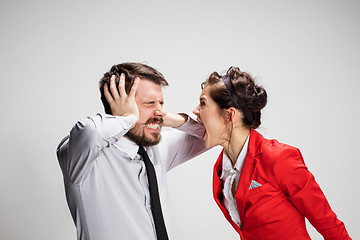 Image showing The business man and woman communicating on a gray background