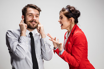 Image showing The business man and woman communicating on a gray background