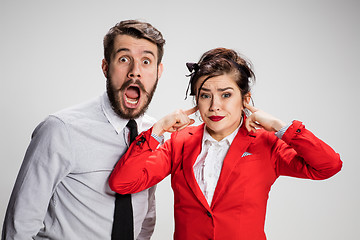 Image showing The business man and woman communicating on a gray background