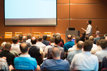 Image showing Business speaker giving a talk in conference hall.