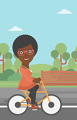 Image showing Woman riding bicycle.