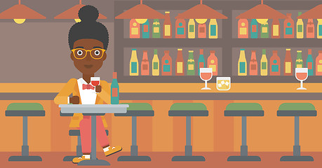 Image showing Woman sitting at bar.