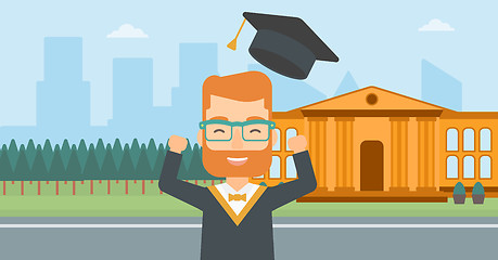 Image showing Graduate throwing up his hat.