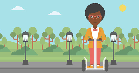 Image showing Woman riding on electric scooter.