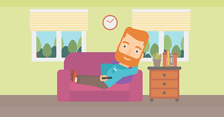 Image showing Man lying on sofa.